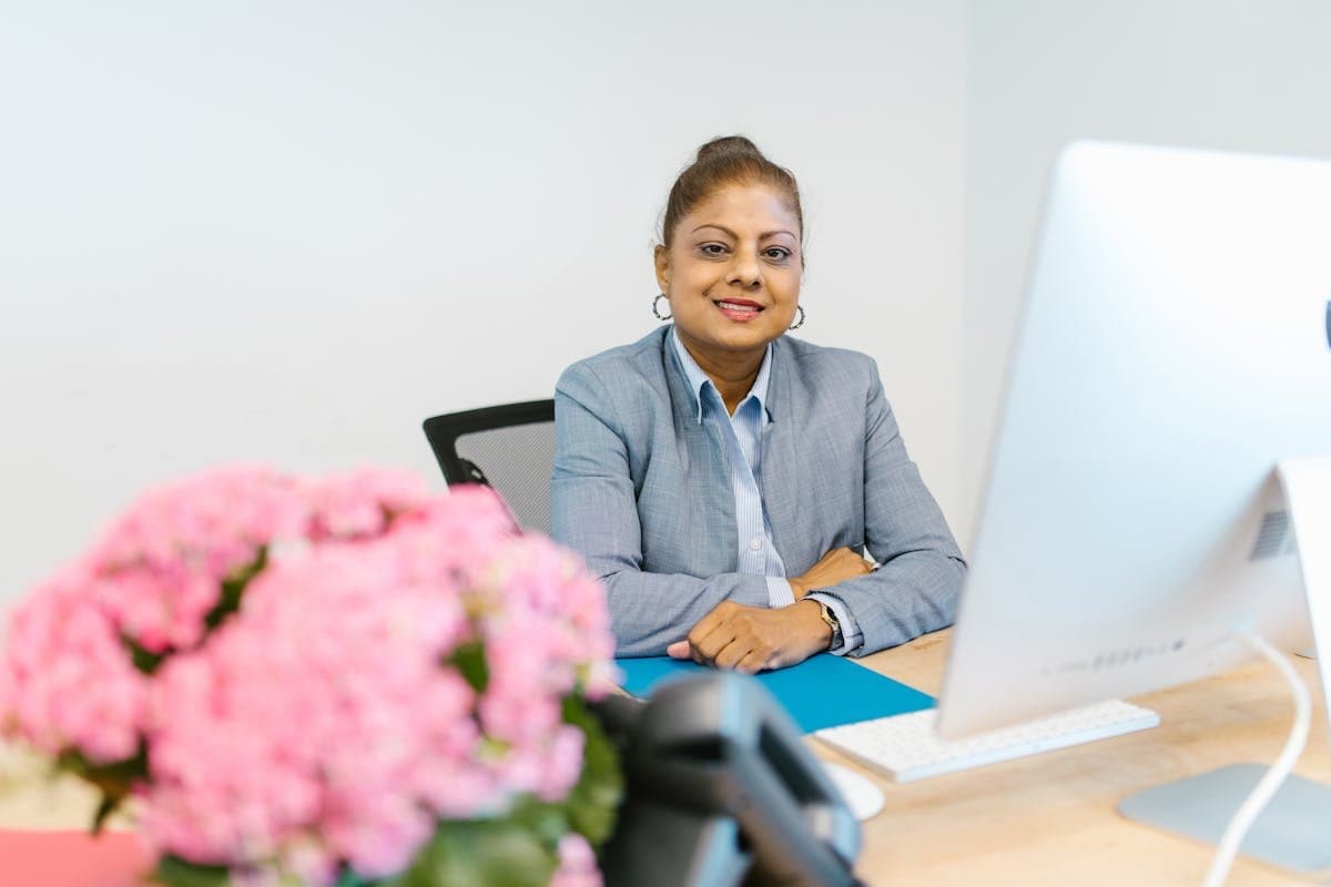 Businesswoman at her desk reviewing accounts