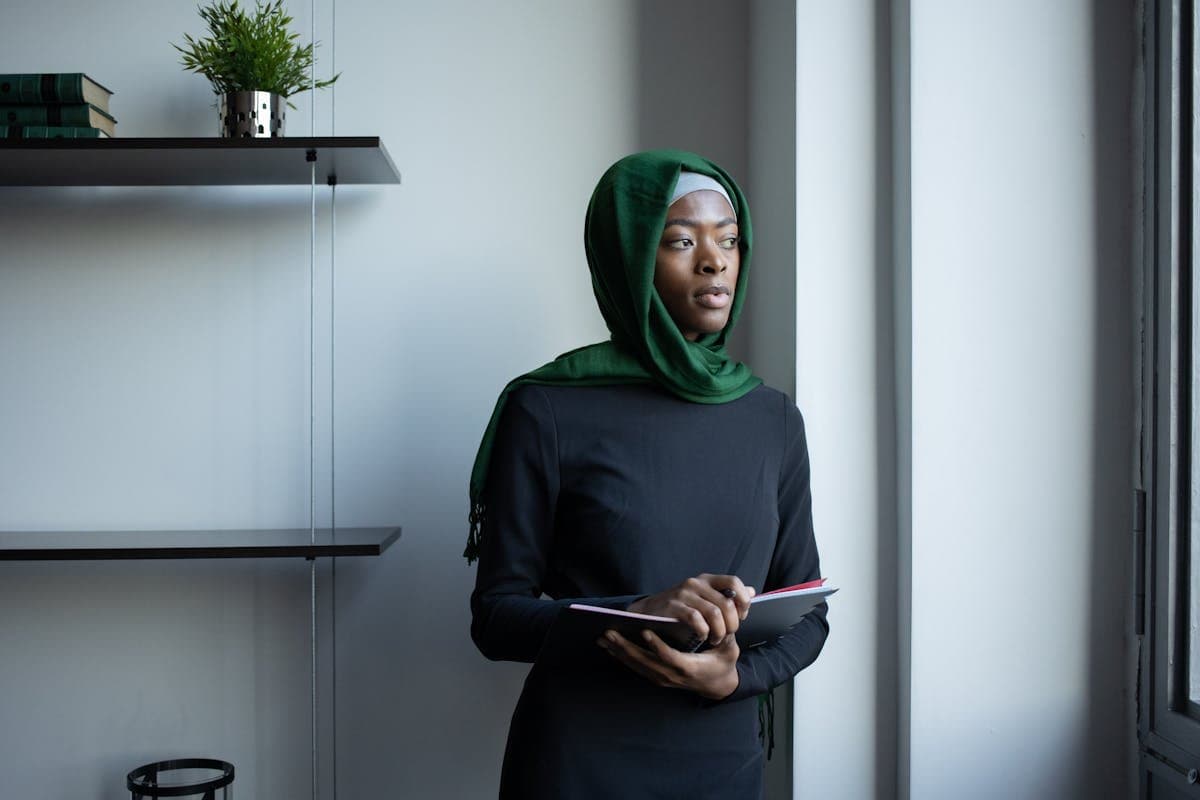Professional woman with notebook in an office